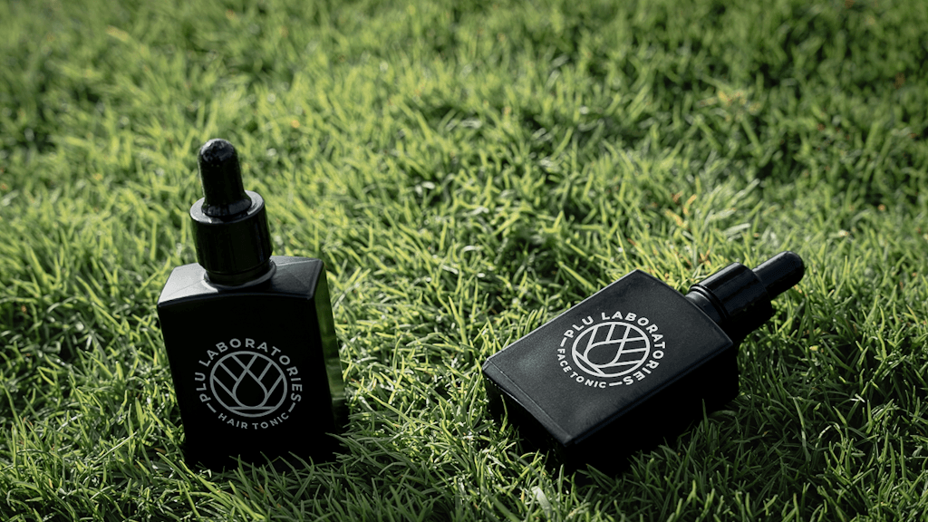 PLU Labs Face and Hair Tonic on Grass