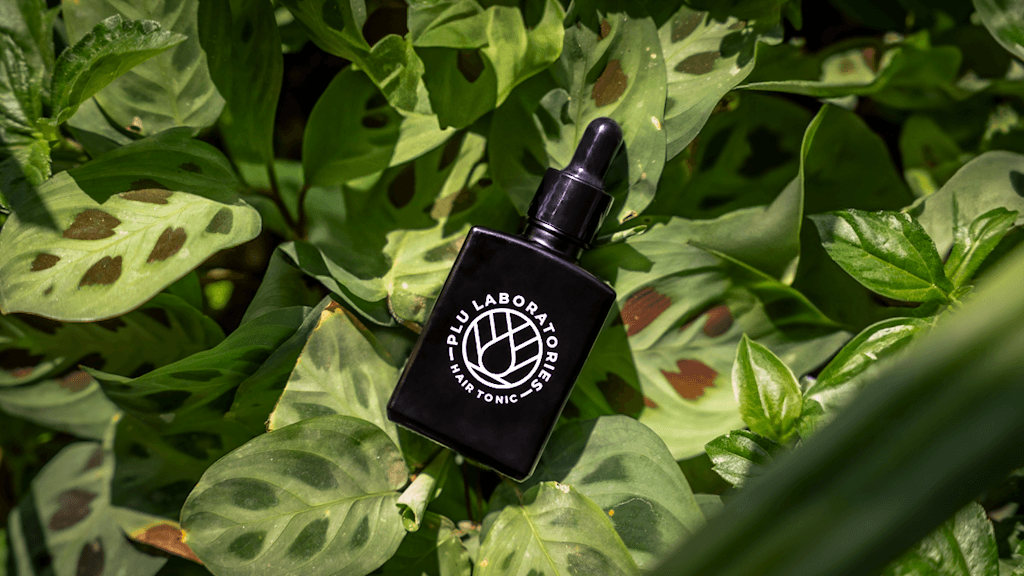 GHK-Cu Hair Tonic on Leaves